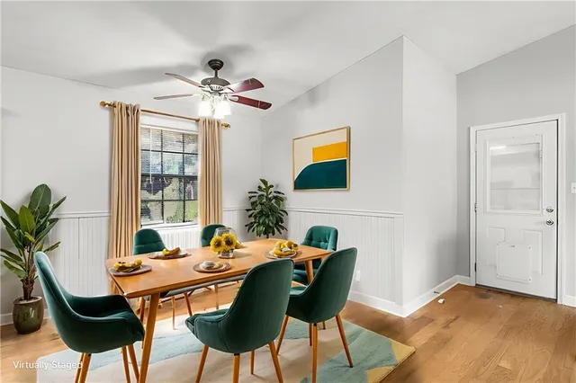 a dining room with a table and chairs