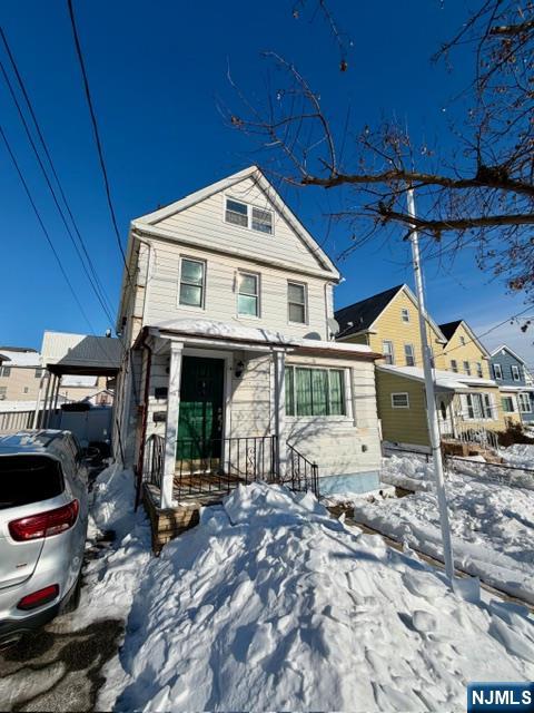 a front view of a house with parking space