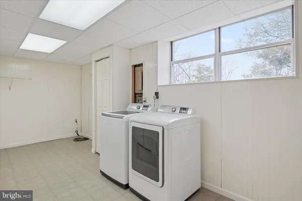 a utility room with dryer and washer