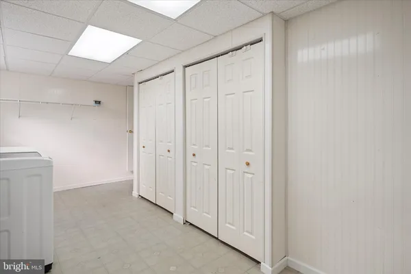 a view of a closet area with hallway