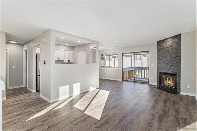 a view of livingroom with hardwood floor and a fireplace