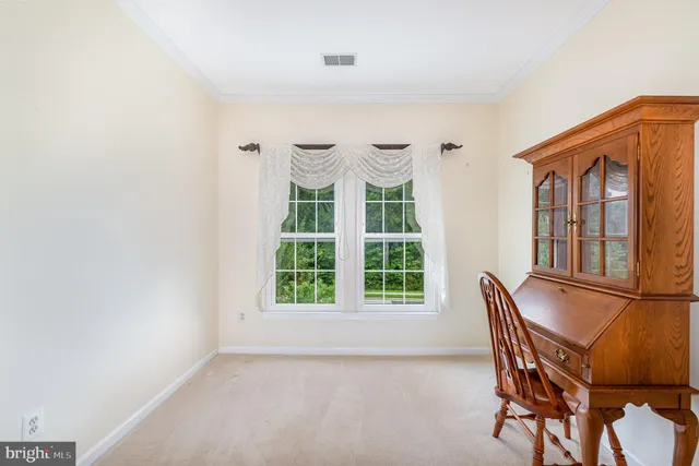 an empty room with windows and mountain view
