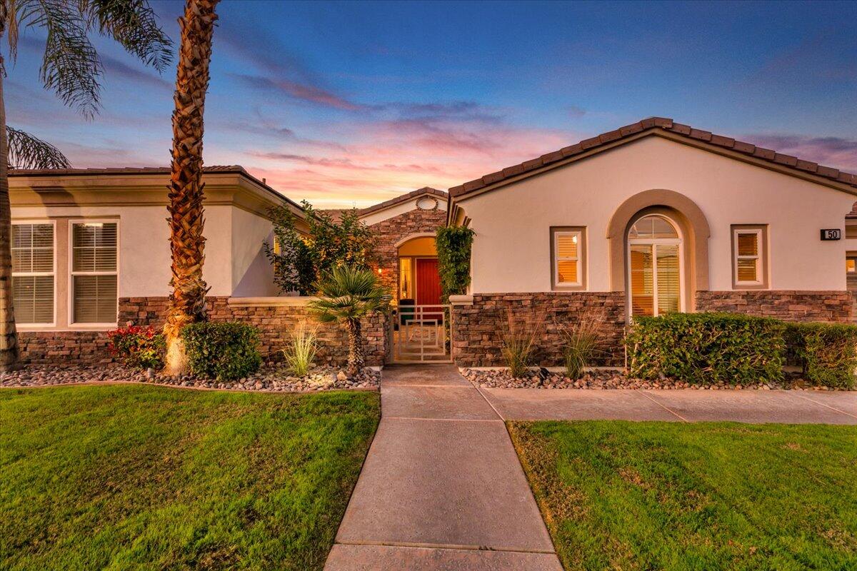 50 Toscana Way East Rancho Mirage, CA 92270 - Photo 3 of 87 005-Front of Home at Twilight