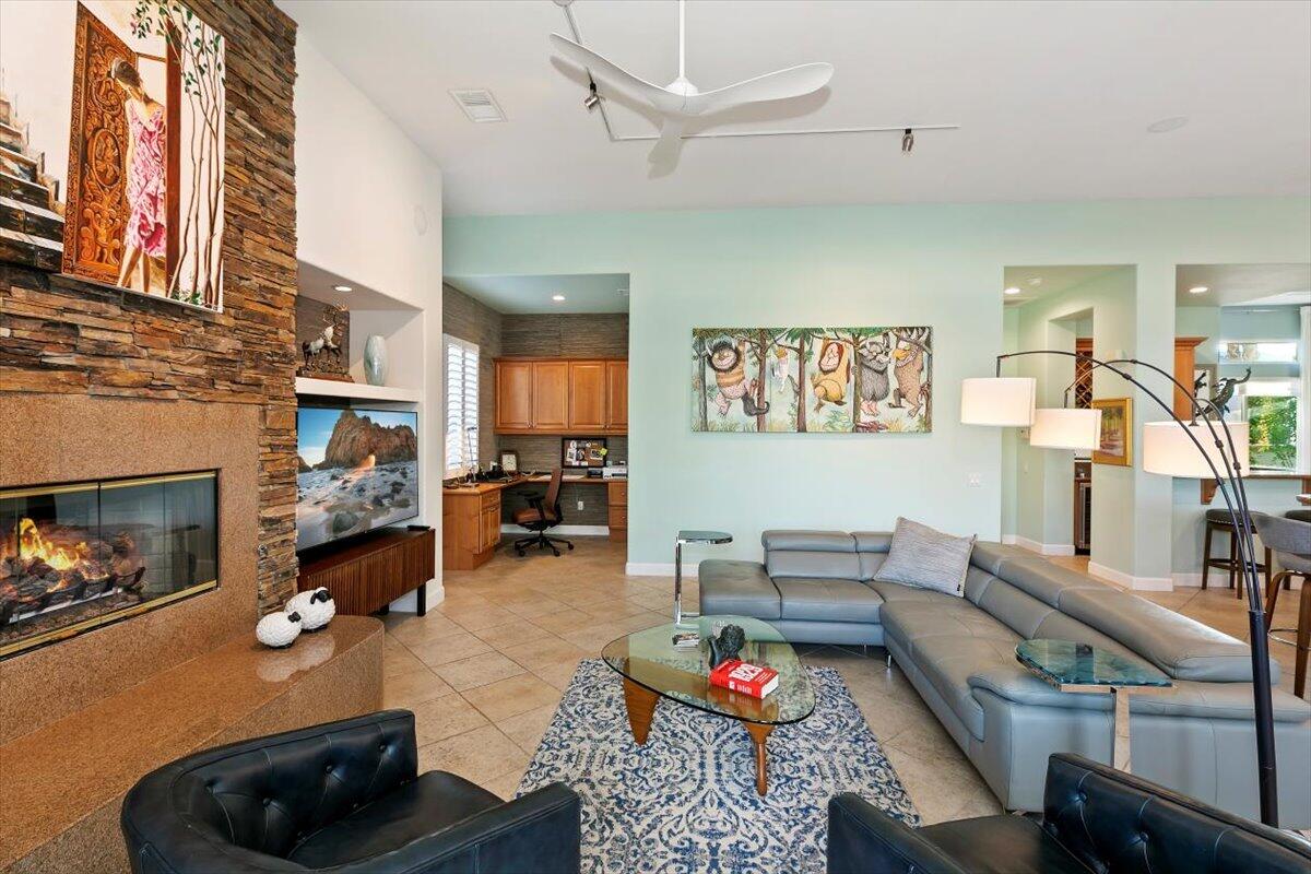 50 Toscana Way East Rancho Mirage, CA 92270 - Photo 37 of 87 a living room with furniture and a fireplace