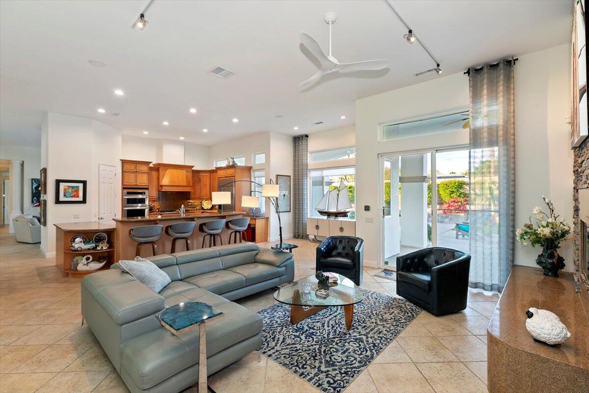 50 Toscana Way East Rancho Mirage, CA 92270 - Photo 39 of 87 a living room with furniture and a flat screen tv