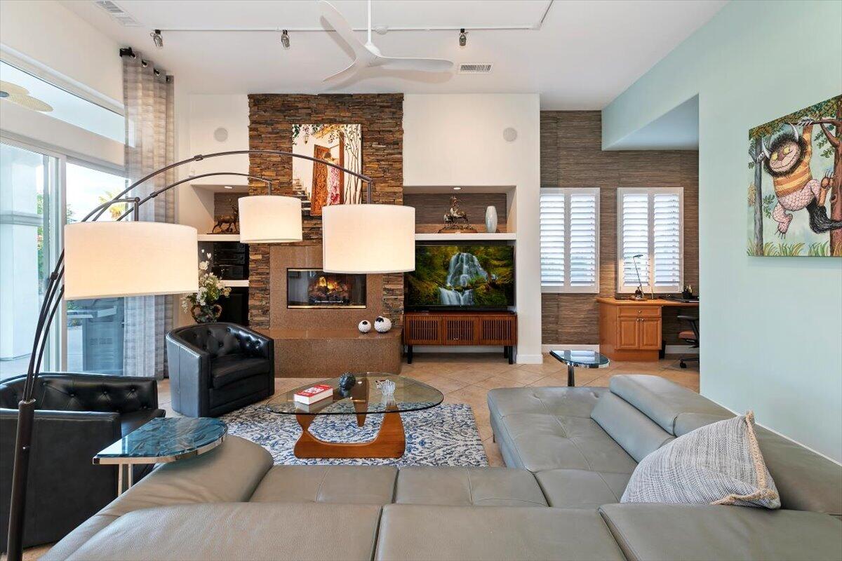 50 Toscana Way East Rancho Mirage, CA 92270 - Photo 40 of 87 a living room with furniture and wooden floor
