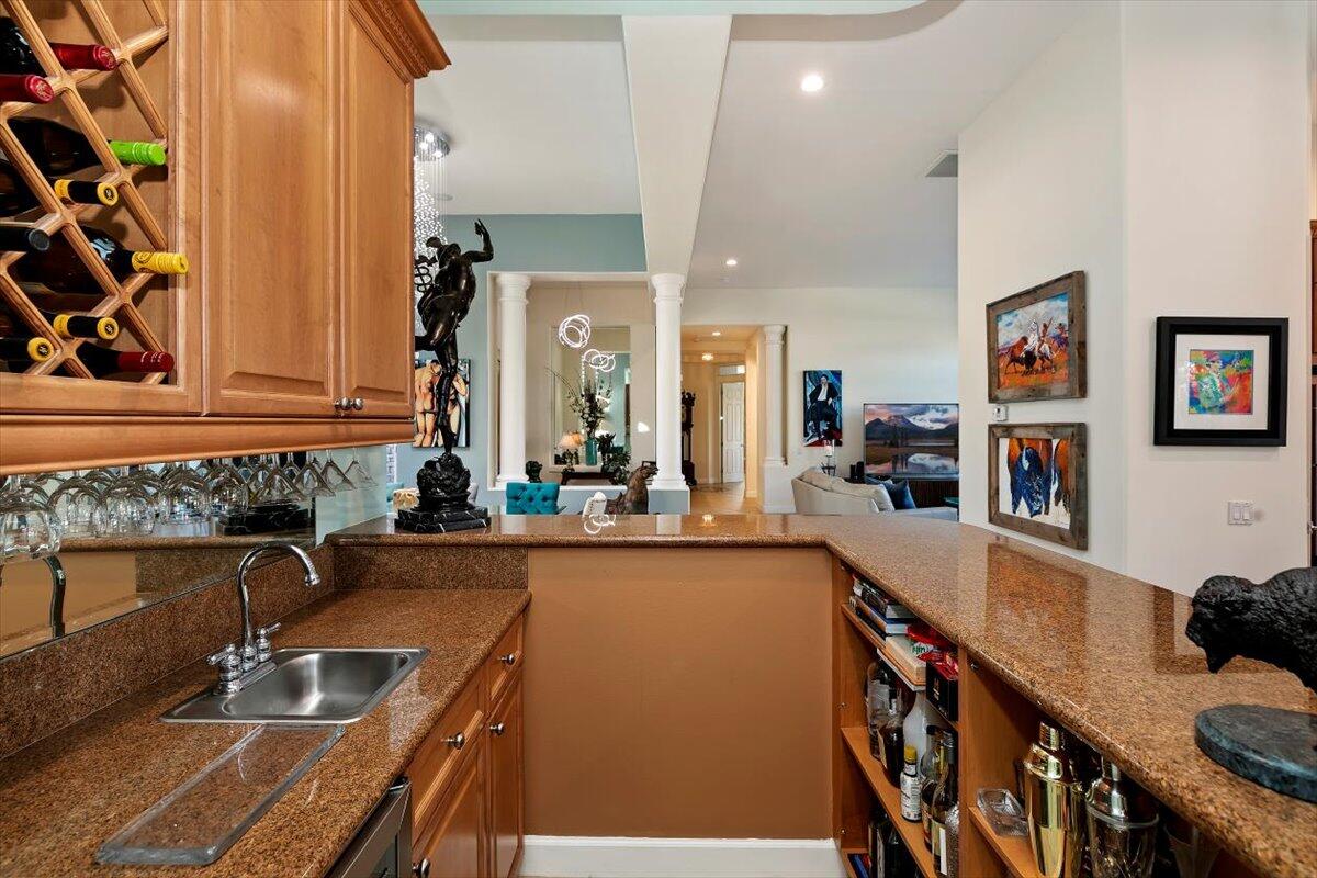 50 Toscana Way East Rancho Mirage, CA 92270 - Photo 41 of 87 a kitchen with sink refrigerator and stove