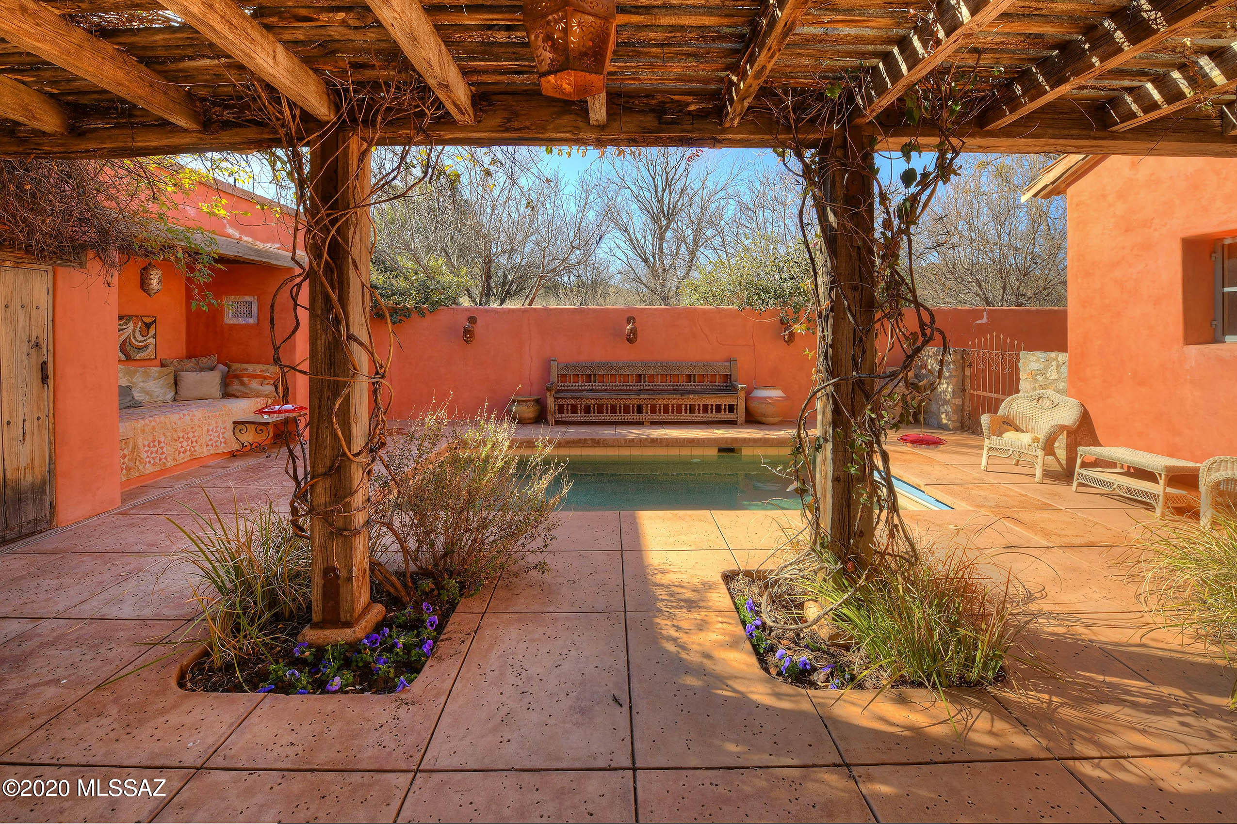 360 Harshaw Creek Road Patagonia, AZ 85624 - Photo 9 of 50 a view of a backyard with plants and a patio