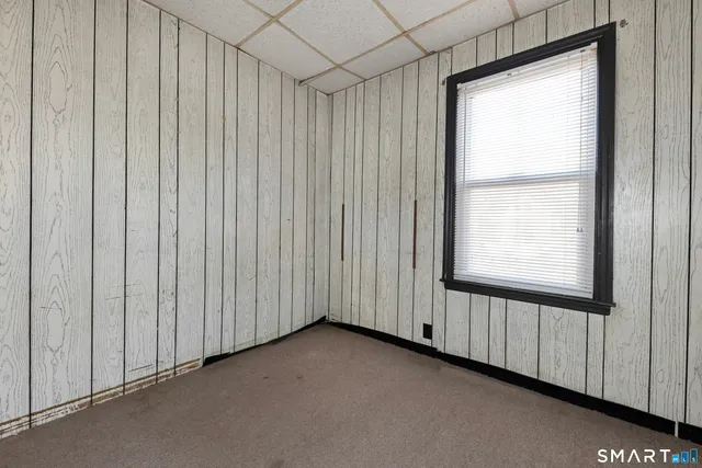 a view of an empty room with windows