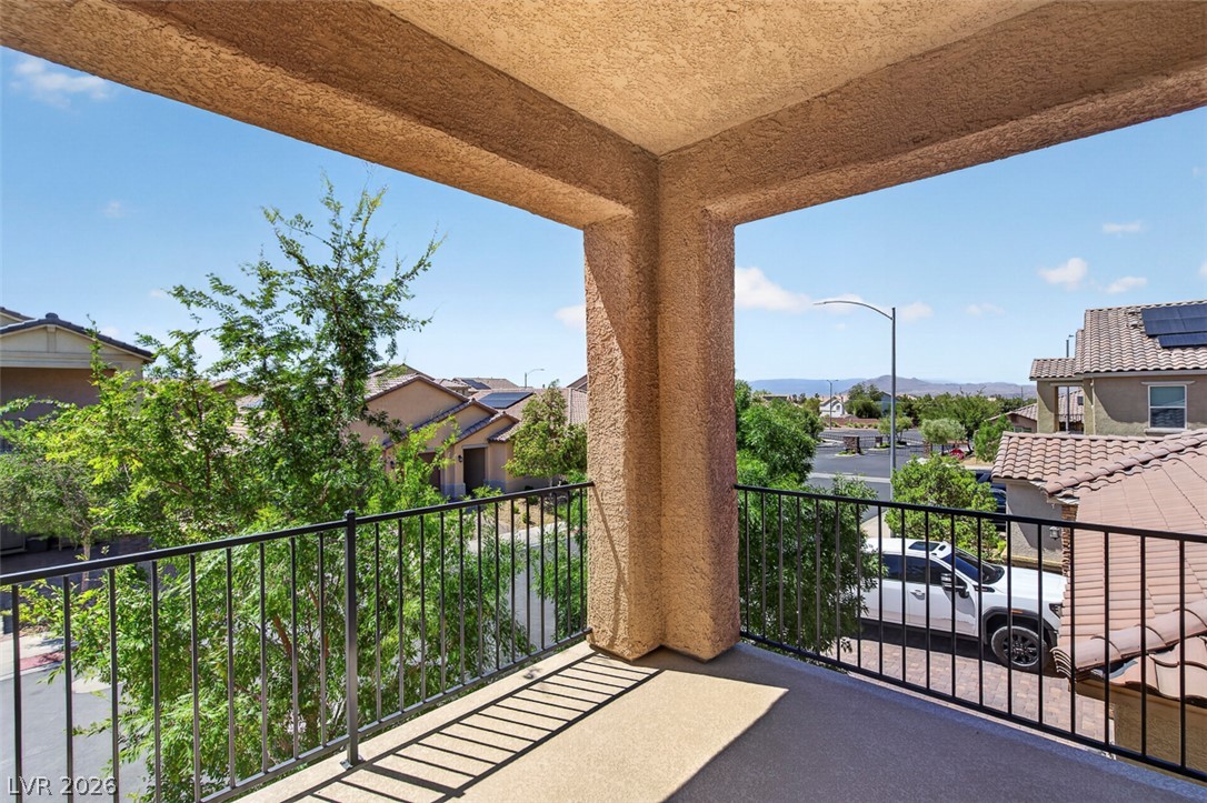 1824 Redland Ridge Street Henderson, NV 89002 - Photo 34 of 69 Enjoy neighborhood views and distant mountains from this private upper-level balcony.