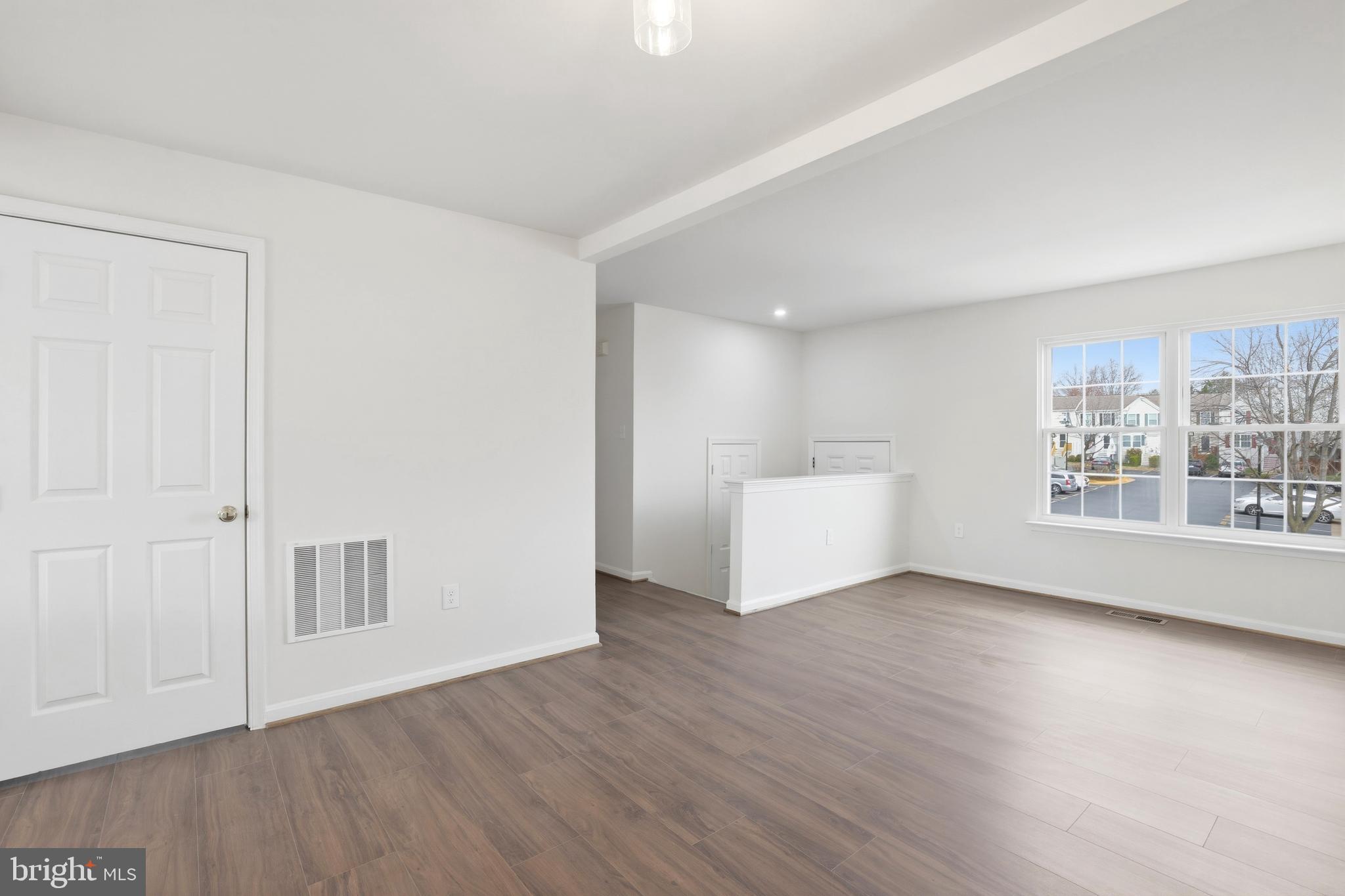 14275 Newbern Loop Gainesville, VA 20155 - Photo 11 of 35 a view of a room with wooden floor and window