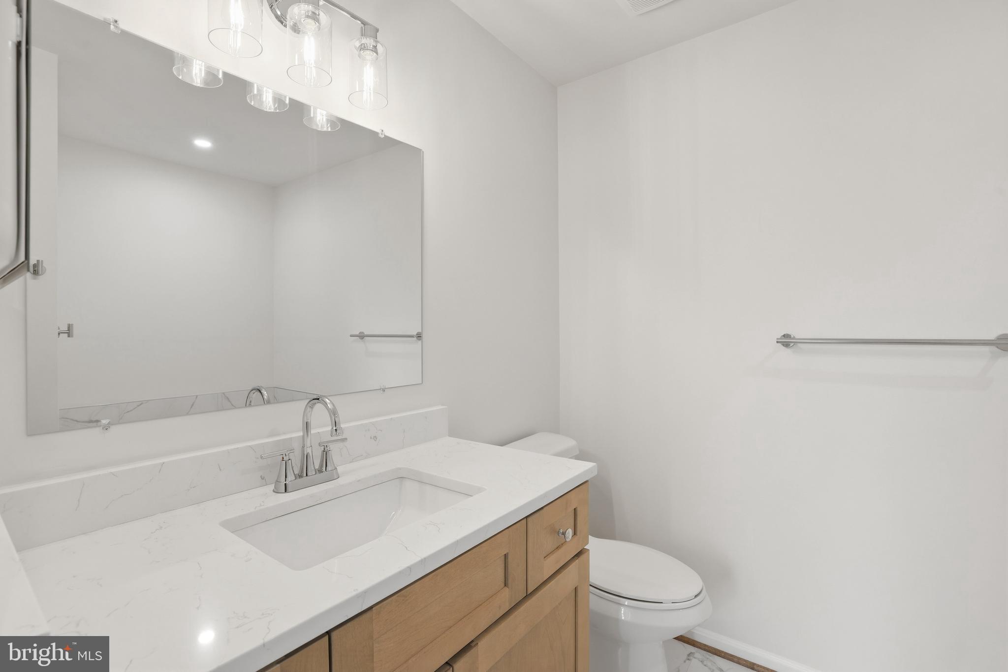 14275 Newbern Loop Gainesville, VA 20155 - Photo 16 of 35 a bathroom with a sink toilet vanity and tub