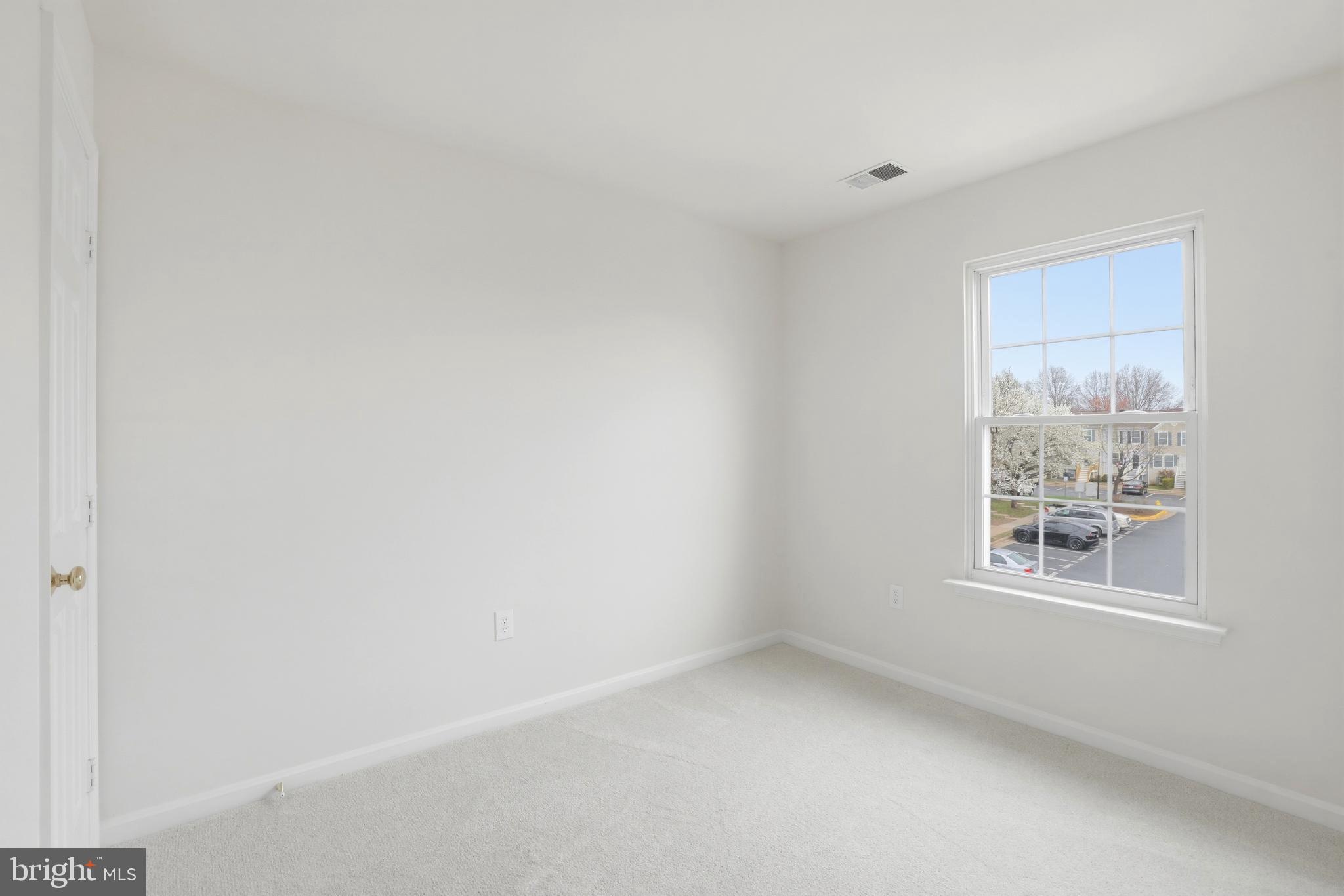 14275 Newbern Loop Gainesville, VA 20155 - Photo 20 of 35 a view of an empty room with a window