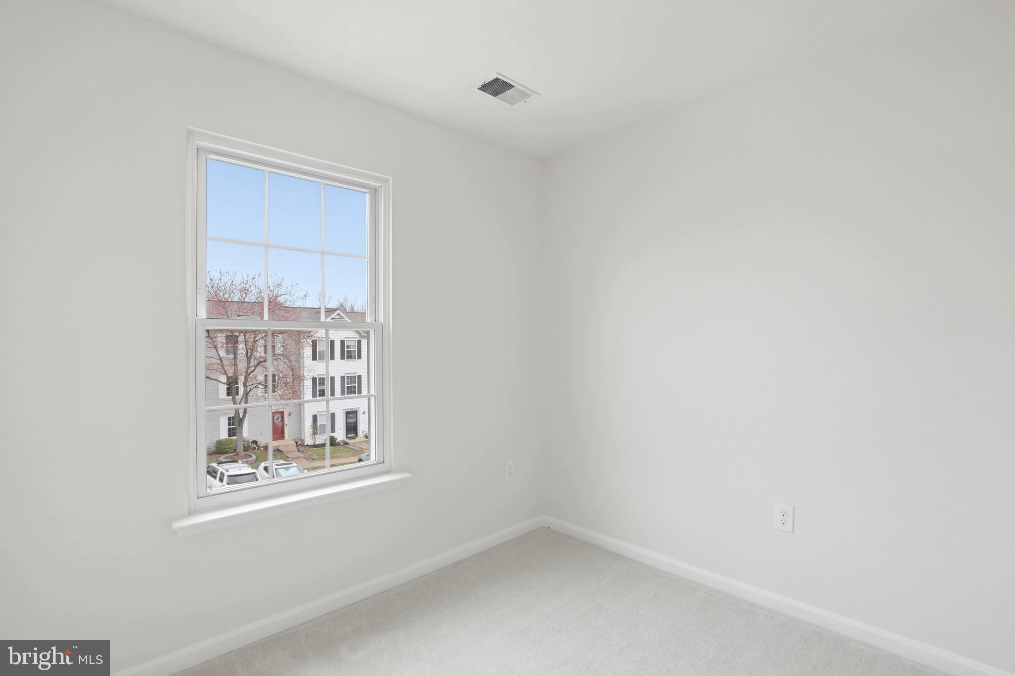 14275 Newbern Loop Gainesville, VA 20155 - Photo 23 of 35 a view of an empty room with a window