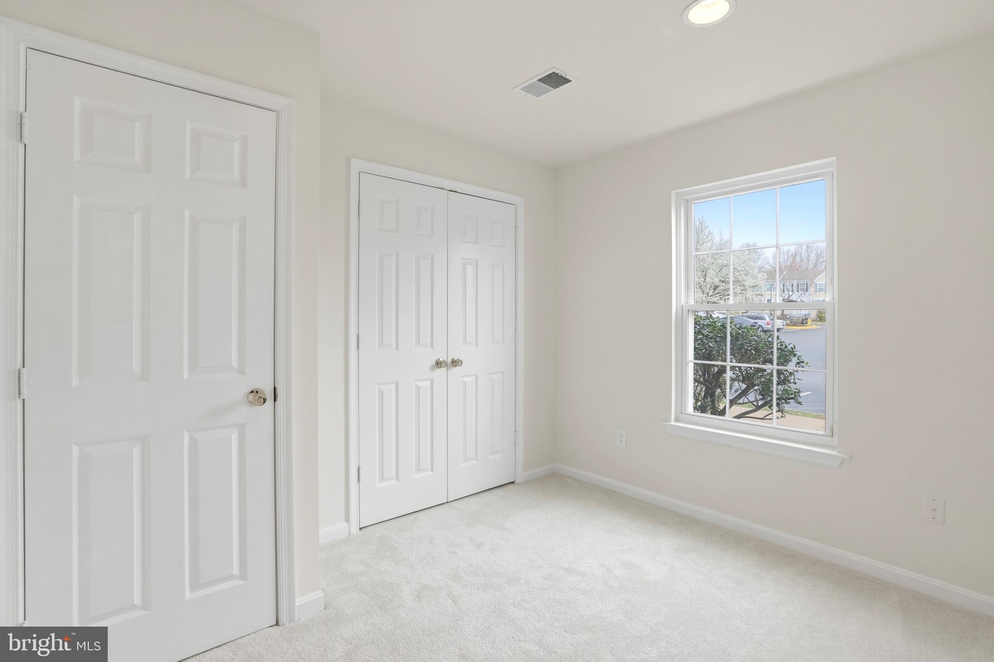 14275 Newbern Loop Gainesville, VA 20155 - Photo 25 of 35 a view of an empty room with a window