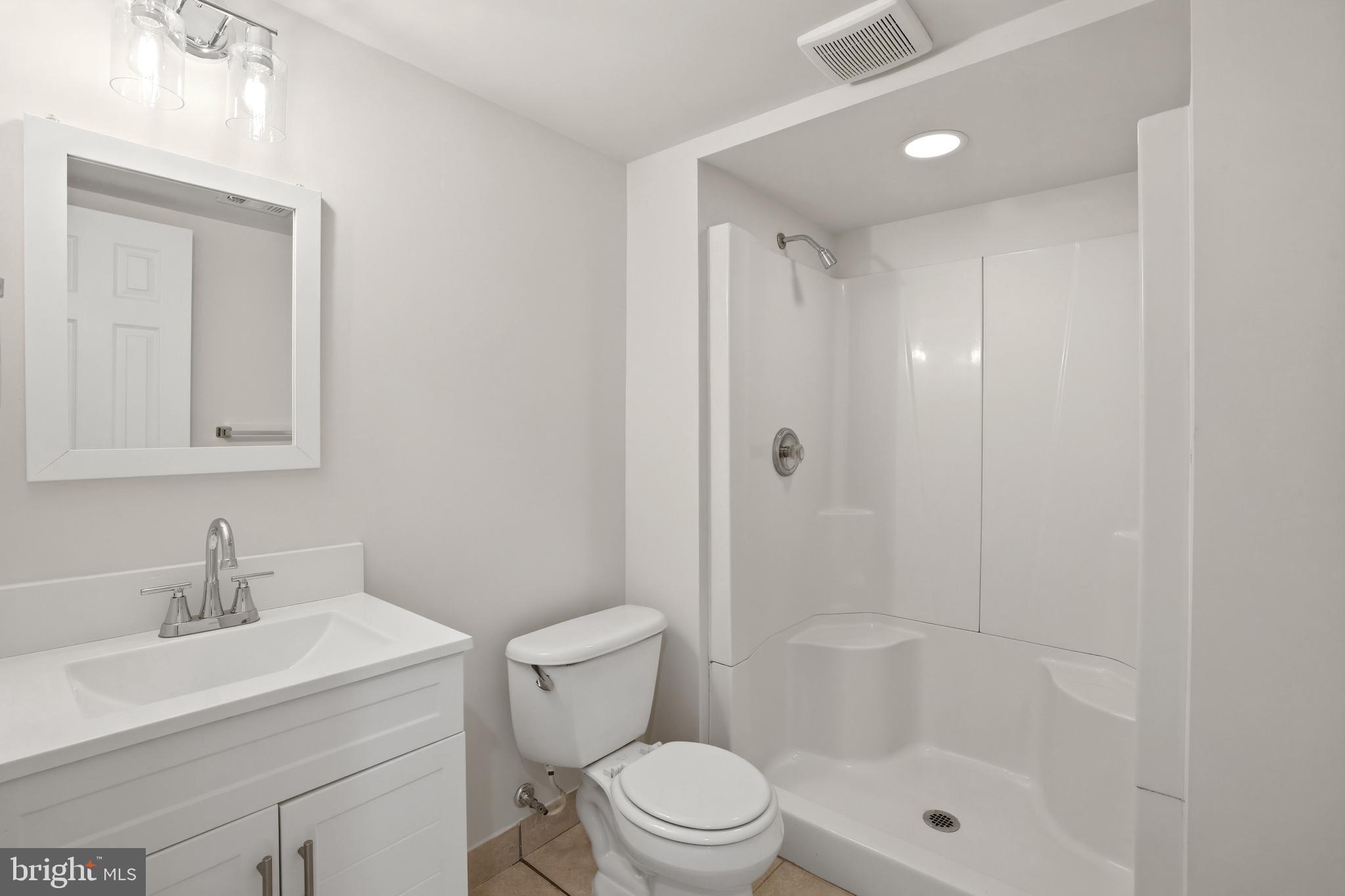 14275 Newbern Loop Gainesville, VA 20155 - Photo 26 of 35 a bathroom with a sink a toilet and shower