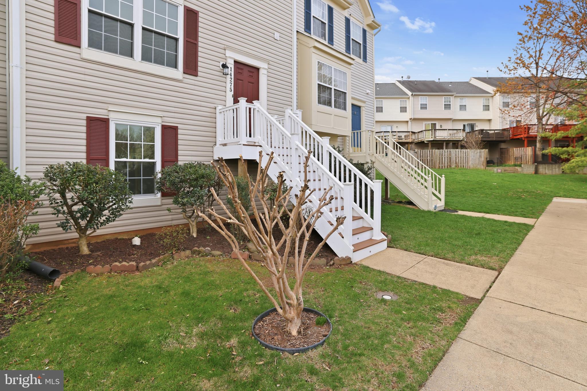 14275 Newbern Loop Gainesville, VA 20155 - Photo 30 of 35 a view of a house with a yard