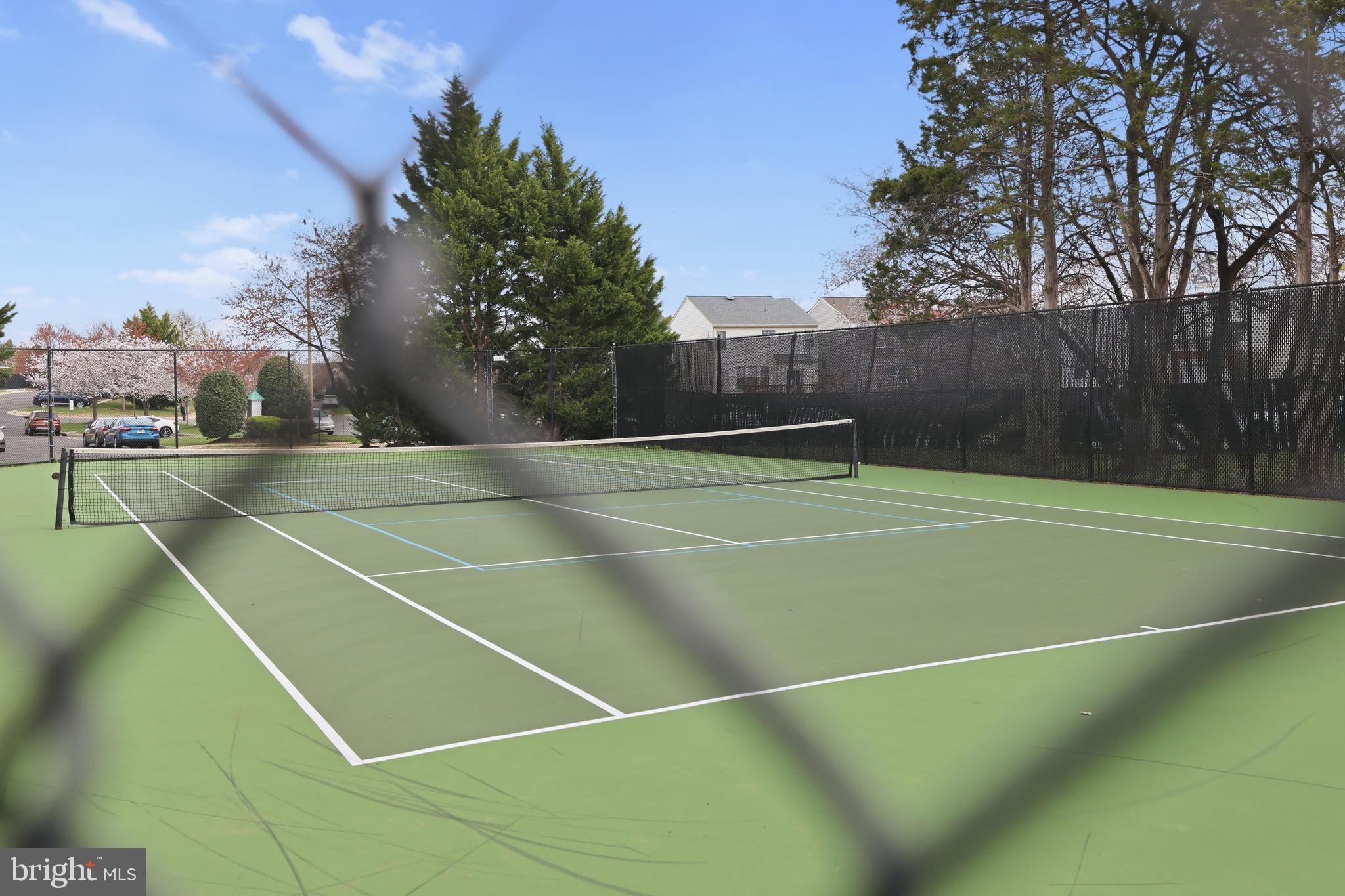 14275 Newbern Loop Gainesville, VA 20155 - Photo 32 of 35 a view of an outdoor space and tennis court