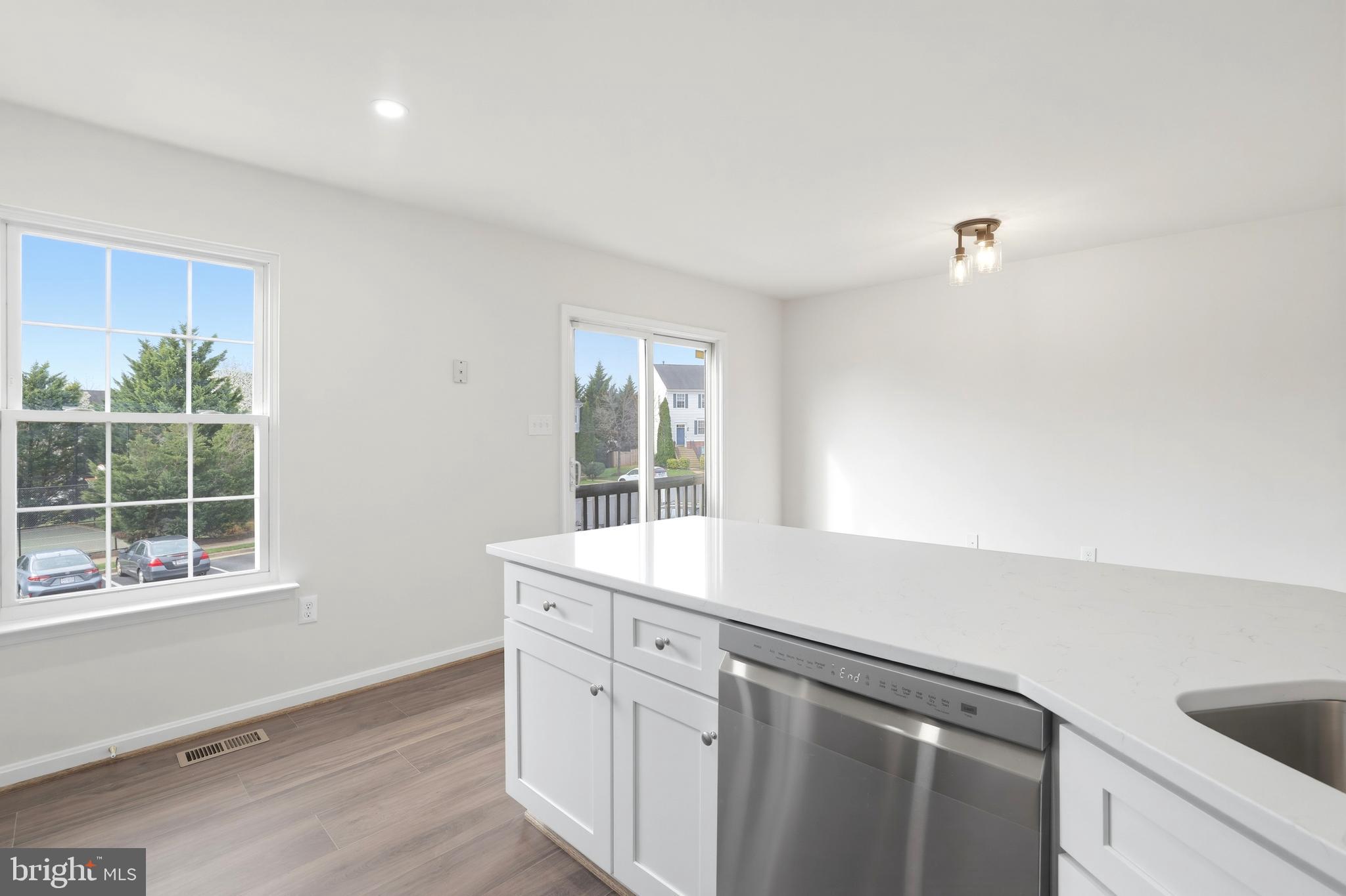 14275 Newbern Loop Gainesville, VA 20155 - Photo 5 of 35 a kitchen with a sink and a window