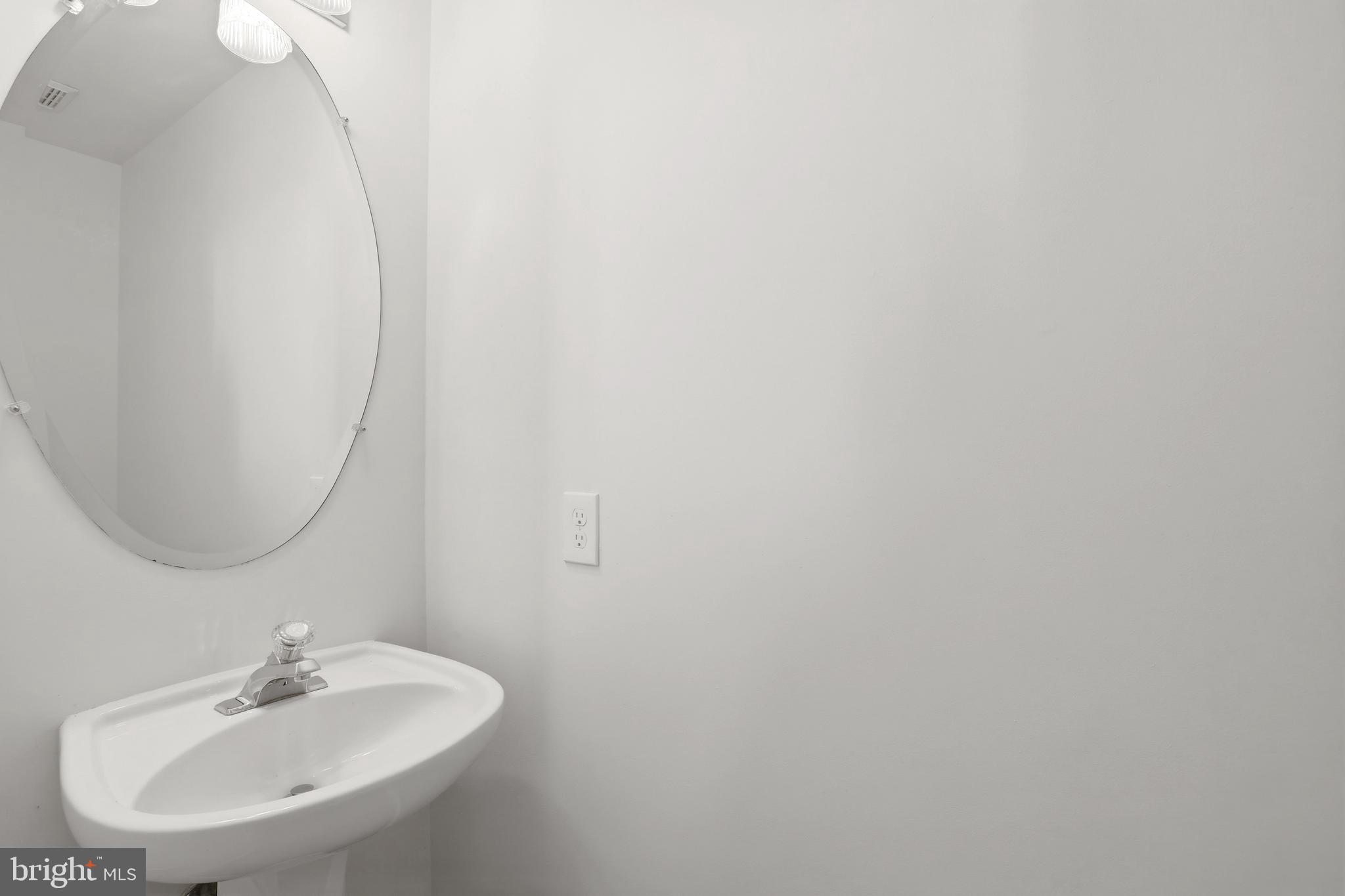 14275 Newbern Loop Gainesville, VA 20155 - Photo 8 of 35 a bathroom with a sink and a mirror