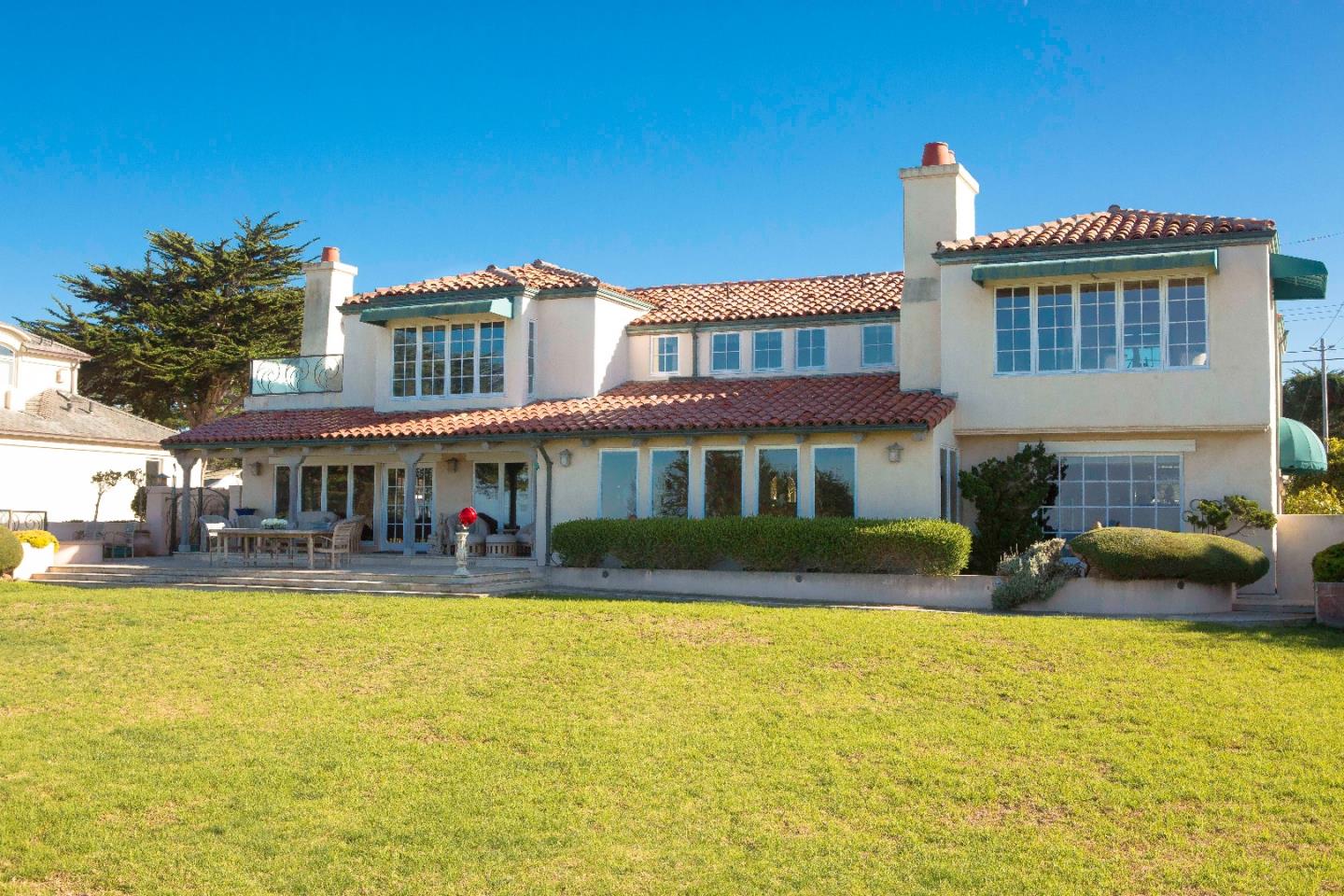 3012 Cormorant Road Pebble Beach, CA 93953 - Photo 2 of 3 a front view of a house with swimming pool and porch
