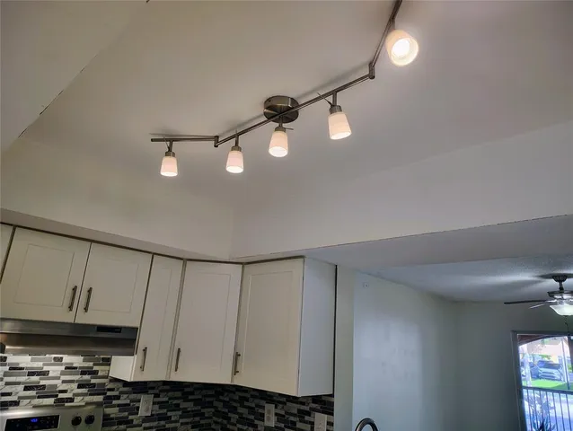 a view of cabinets and window