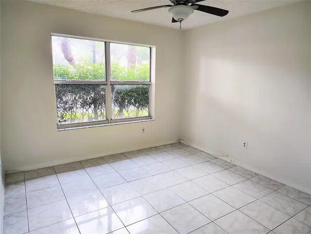 a utility room with stainless steel appliances a chimney and a table