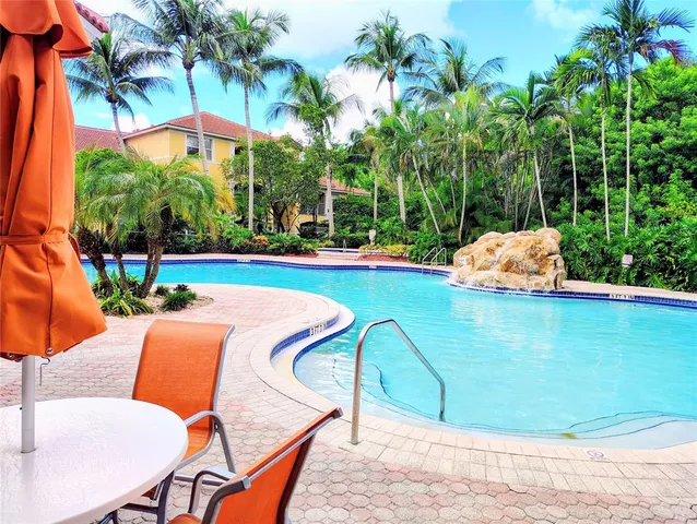 a living room with lots of furniture and gym equipment