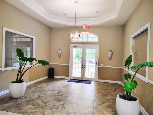 a living room with furniture a window and wall painting