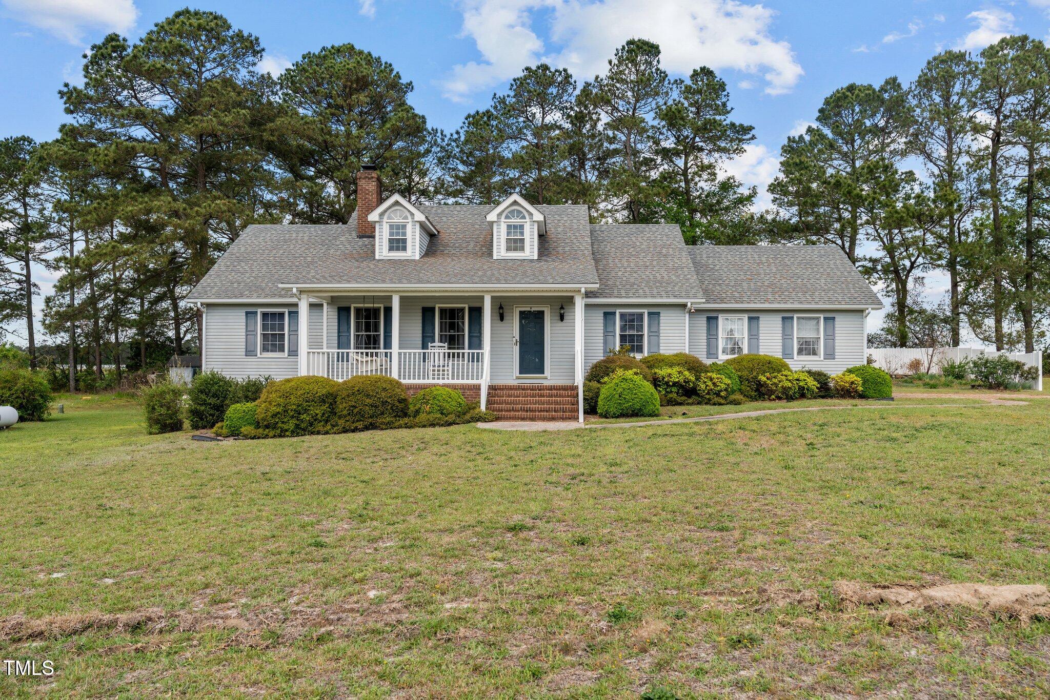 664 Marler Road Benson, NC 27504 - Photo 1 of 47 a front view of a house with a garden