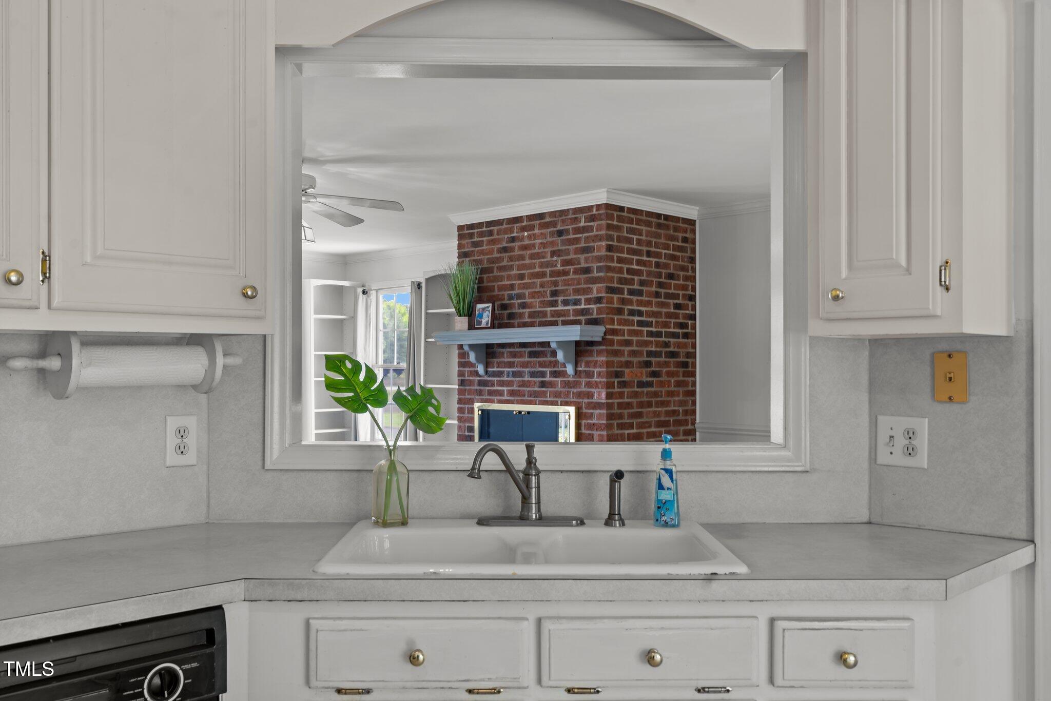 664 Marler Road Benson, NC 27504 - Photo 21 of 47 a kitchen with granite countertop a sink stainless steel appliances and cabinets