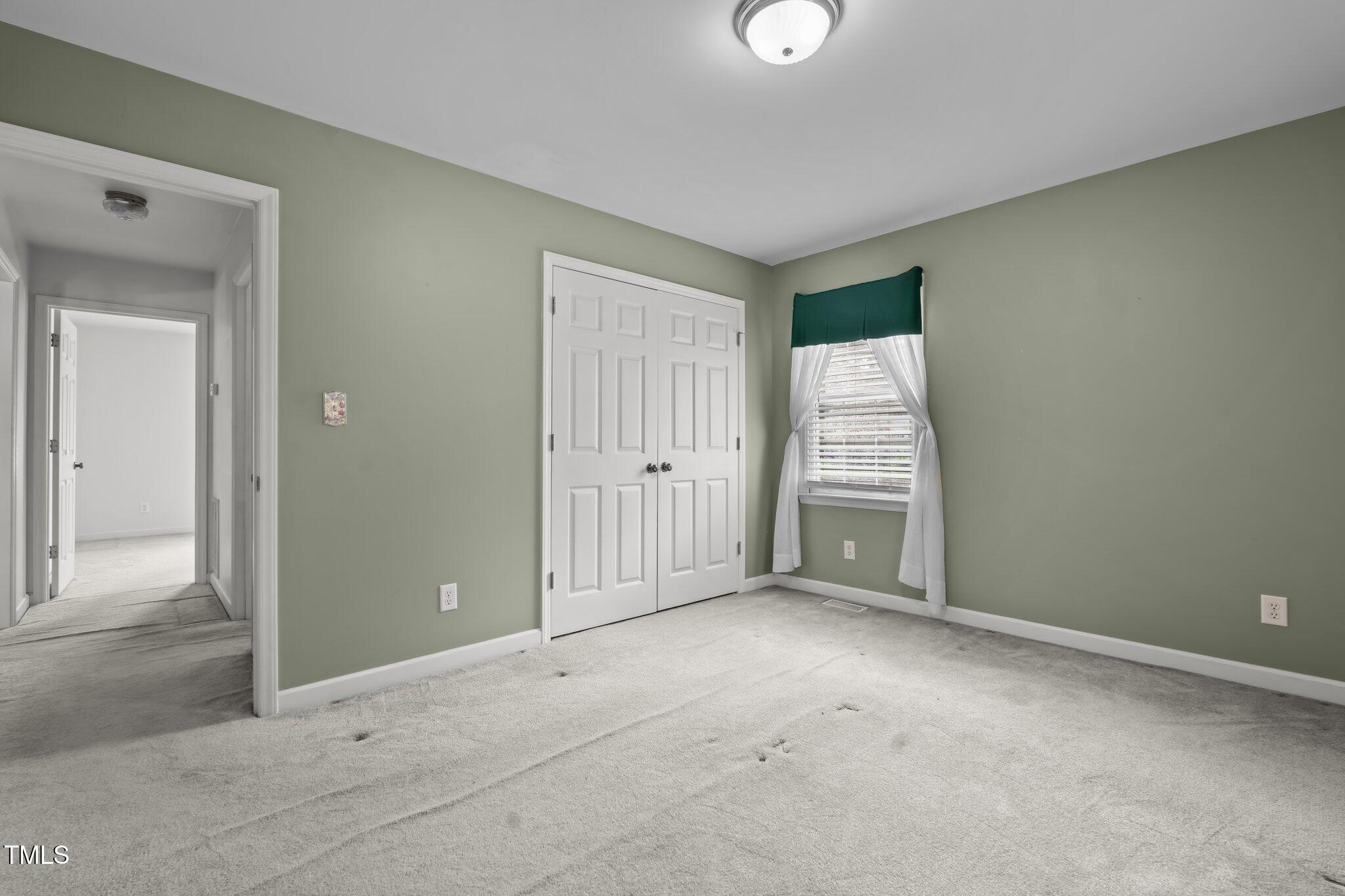 664 Marler Road Benson, NC 27504 - Photo 33 of 47 an empty room with windows and closet