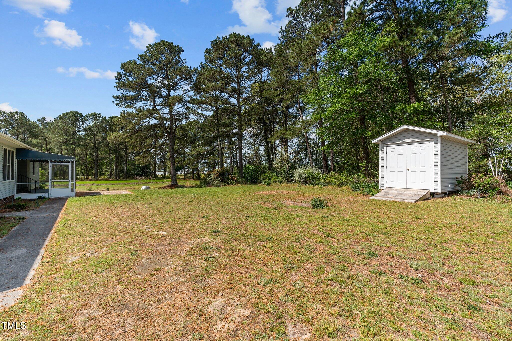664 Marler Road Benson, NC 27504 - Photo 44 of 47 a view of a backyard with large trees