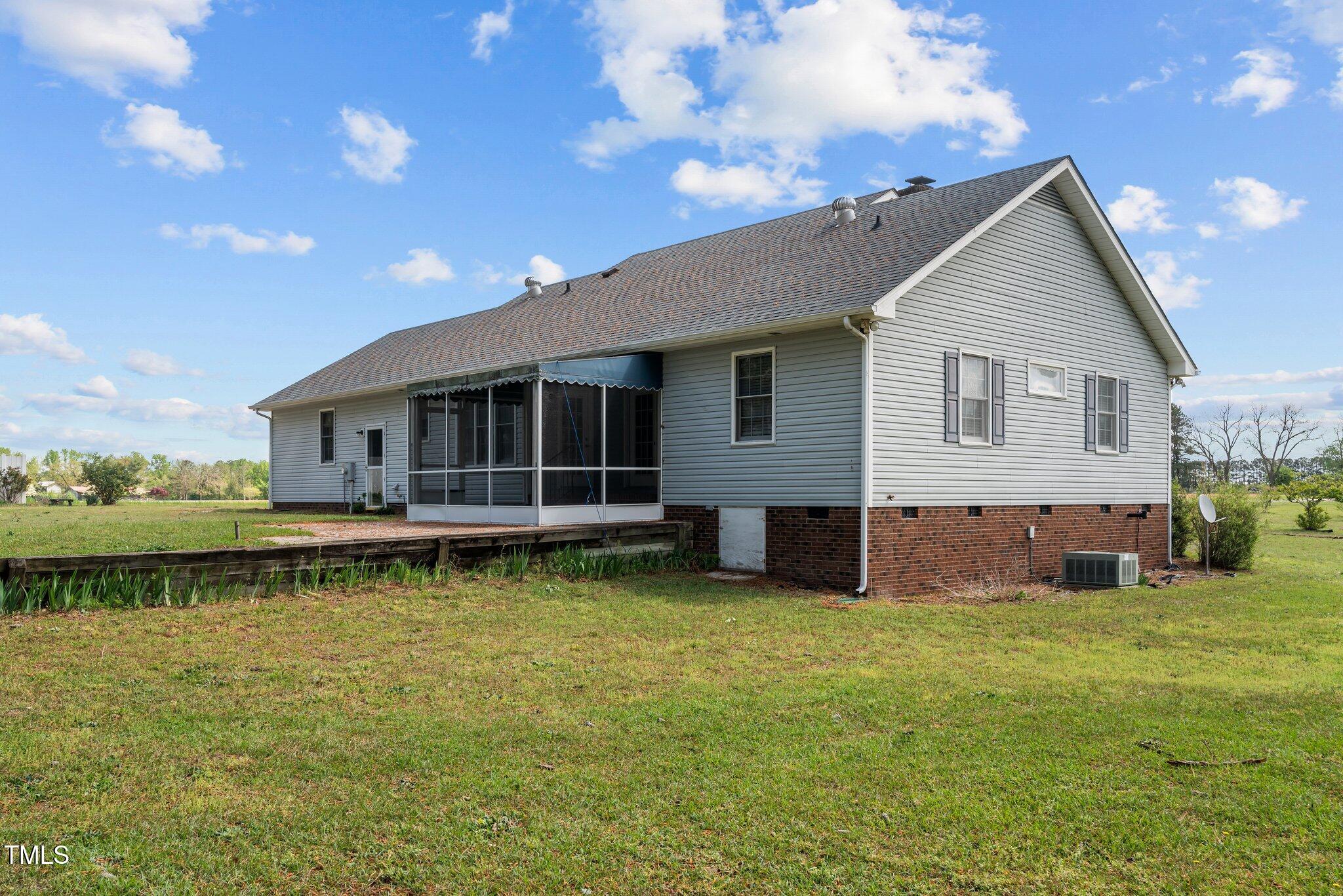 664 Marler Road Benson, NC 27504 - Photo 6 of 47 a view of a house with a yard porch and sitting area