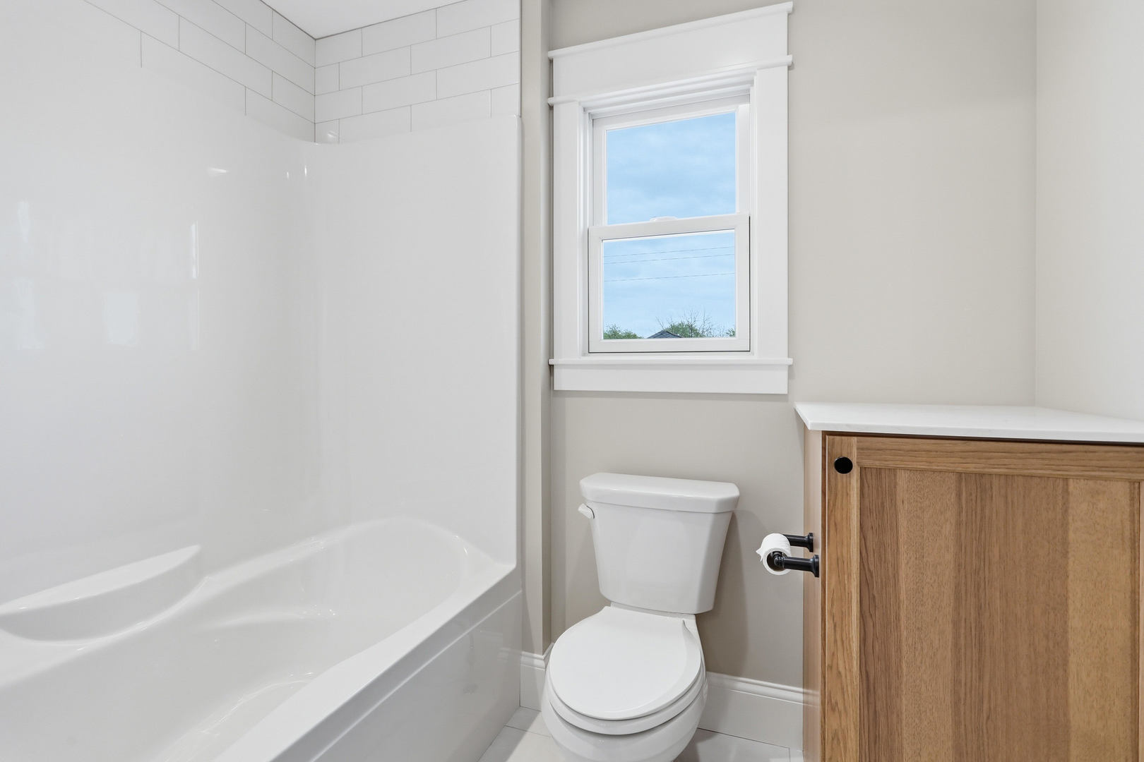 6928 Wilderness Pointe Bettendorf, IA 52722 - Photo 38 of 48 a white toilet sitting next to a bath tub