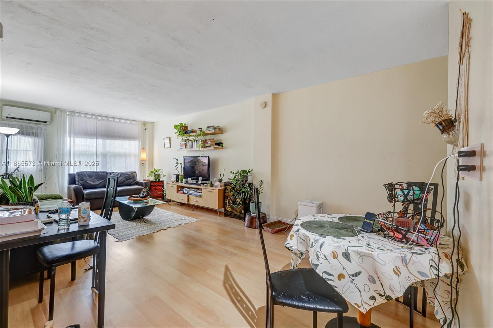 1300 Lincoln Road, Unit B402 Miami Beach, FL 33139 - Photo 11 of 34 a living room with furniture and a wooden floor