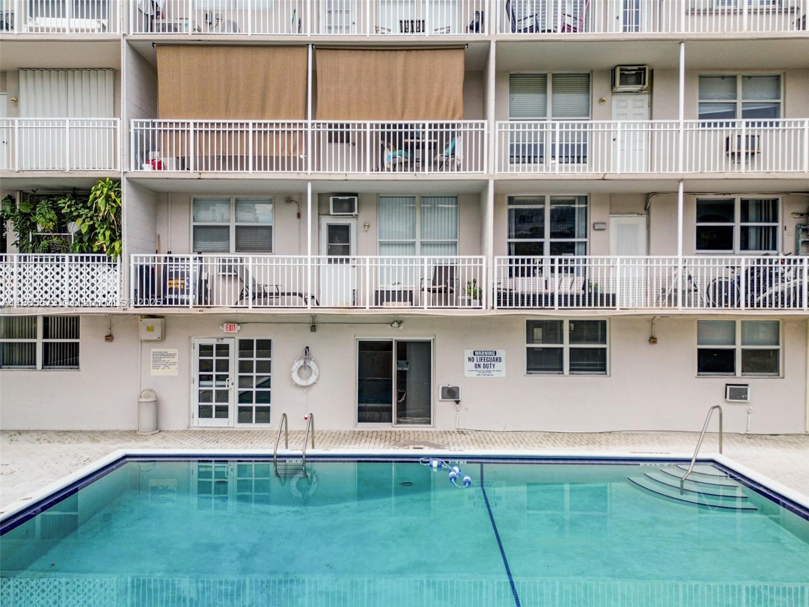 1300 Lincoln Road, Unit B402 Miami Beach, FL 33139 - Photo 27 of 34 a front view of a house with windows