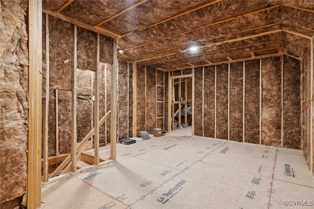 a large kitchen with kitchen island stainless steel appliances a table chairs sink and stove top oven