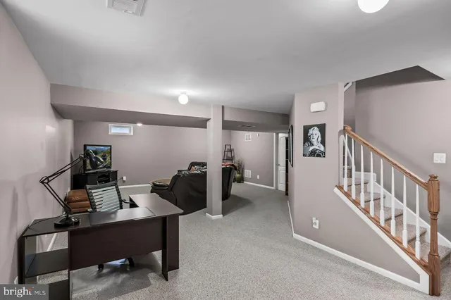 a view of a workspace with furniture