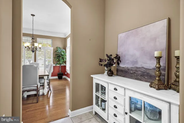 a view of living room with furniture and wooden floor