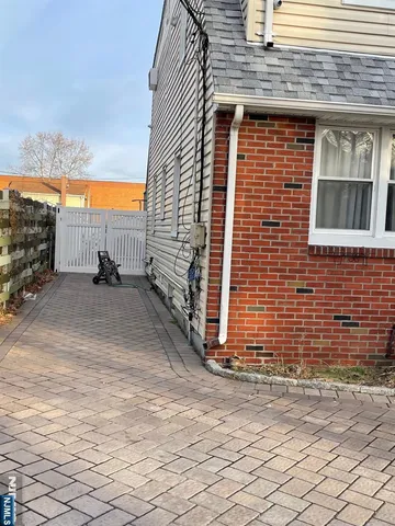 a view of a brick house with an outdoor space