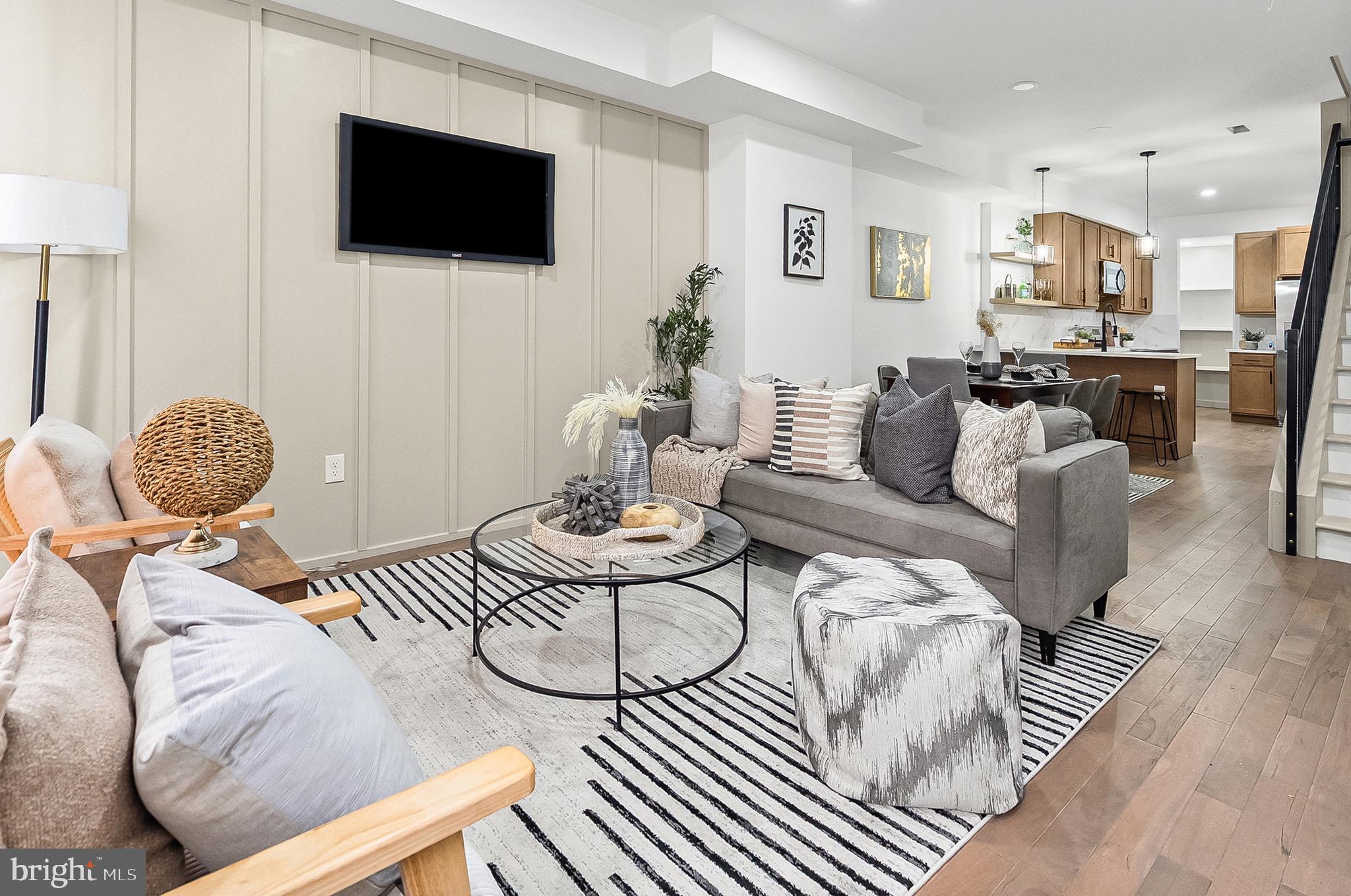 2508 East Preston Street Baltimore, MD 21213 - Photo 1 of 29 a living room with furniture and a flat screen tv
