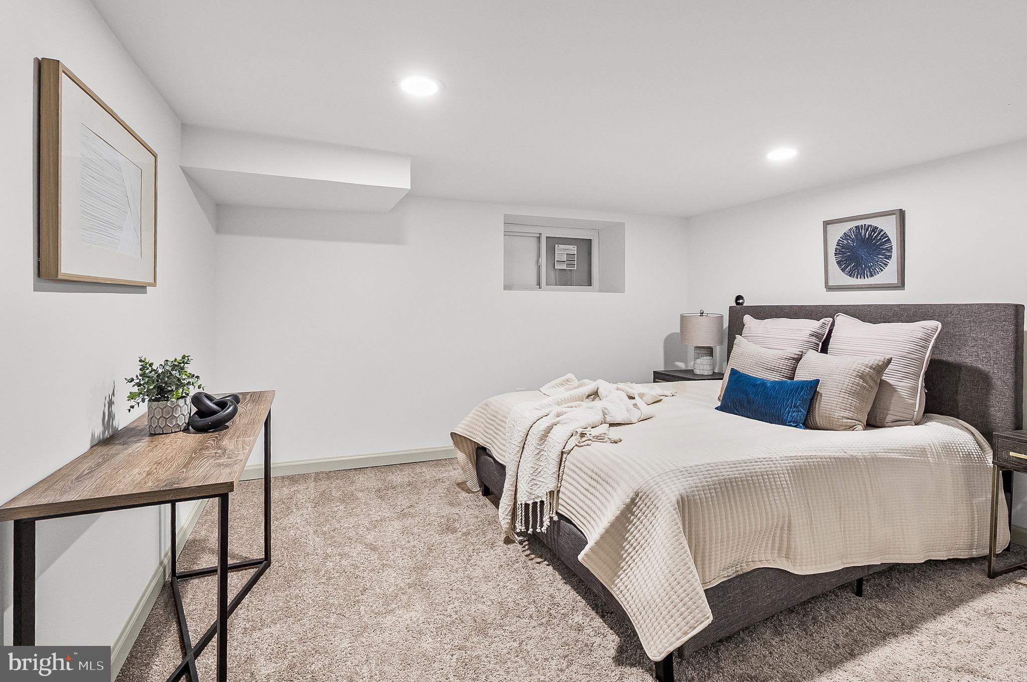 2508 East Preston Street Baltimore, MD 21213 - Photo 13 of 29 a bedroom with a bed and a potted plant