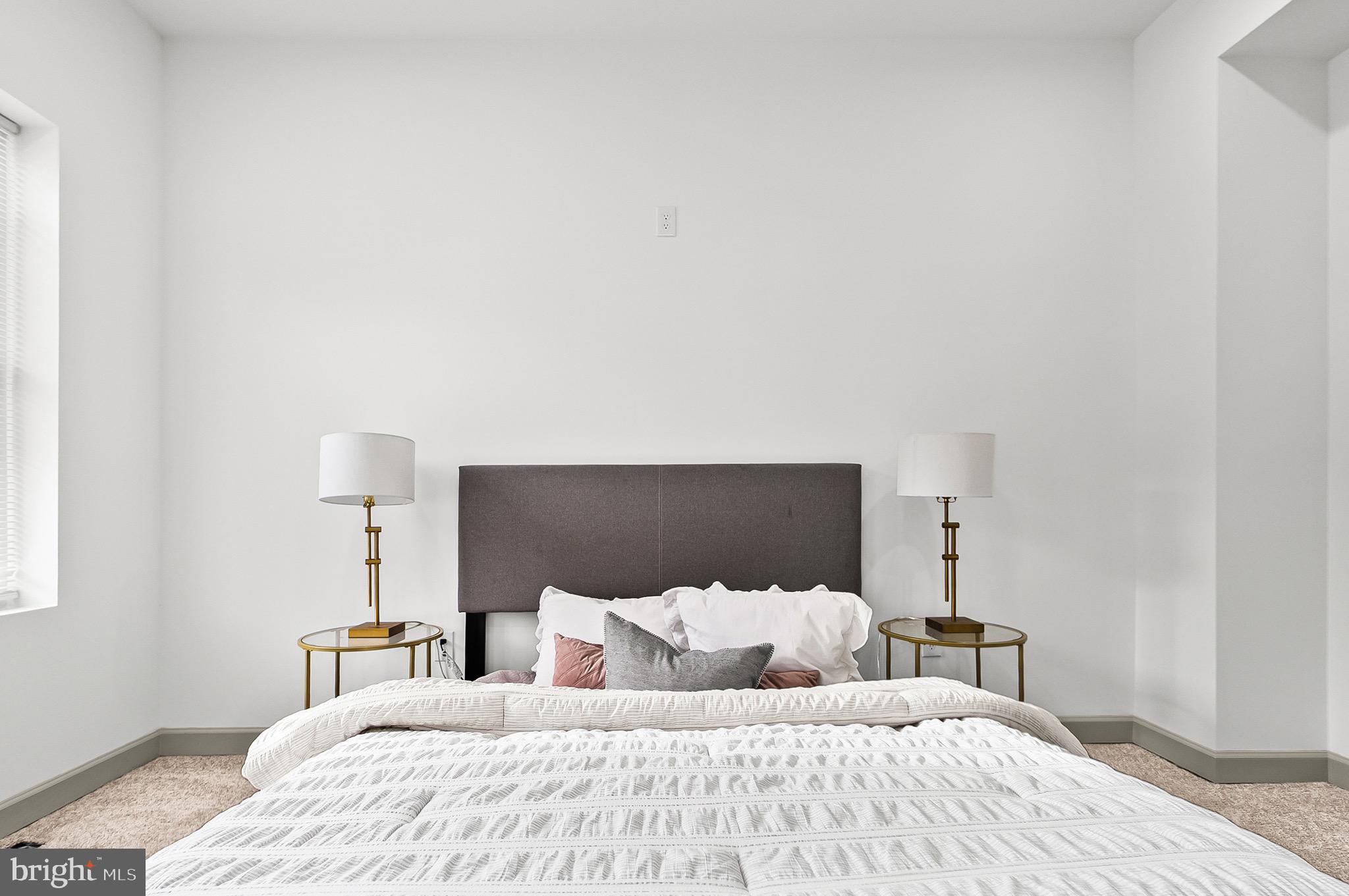 2508 East Preston Street Baltimore, MD 21213 - Photo 15 of 29 a bedroom with a bed and a night lamp