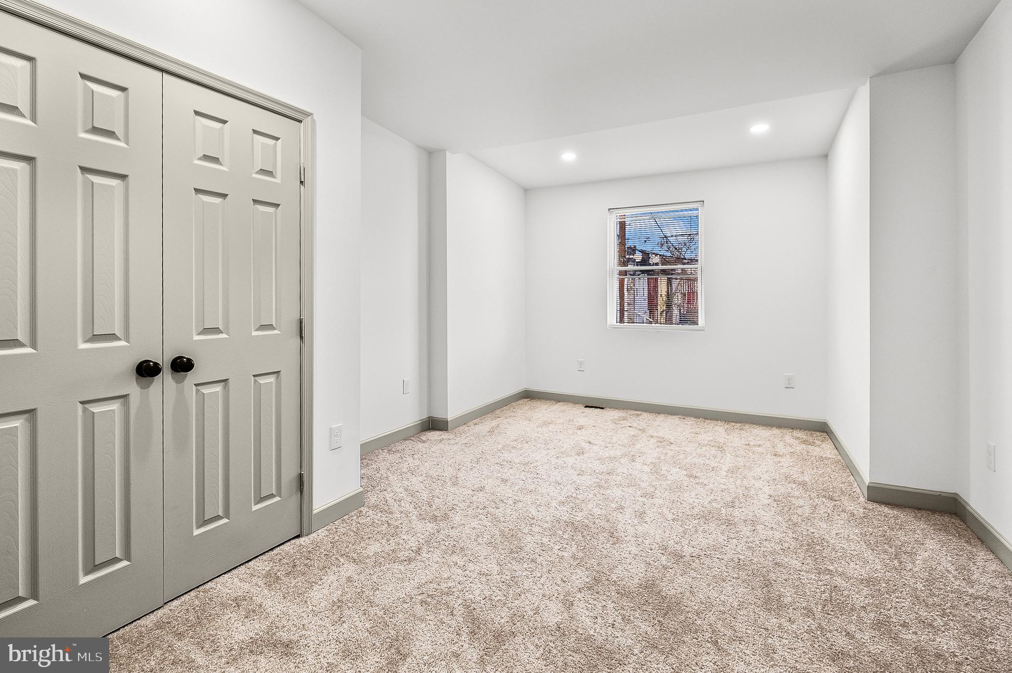 2508 East Preston Street Baltimore, MD 21213 - Photo 20 of 29 an empty room with windows