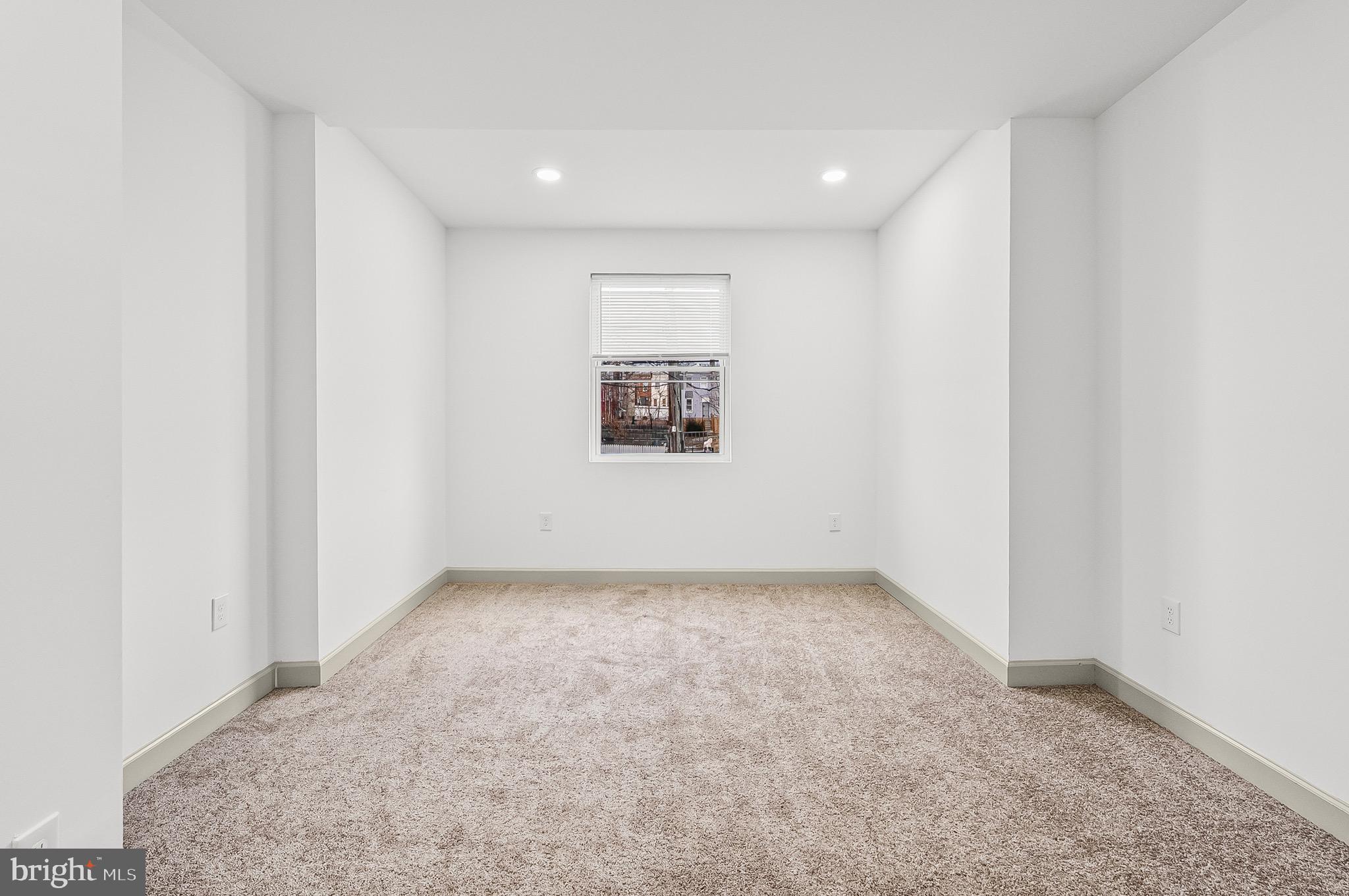 2508 East Preston Street Baltimore, MD 21213 - Photo 23 of 29 an empty room with a window