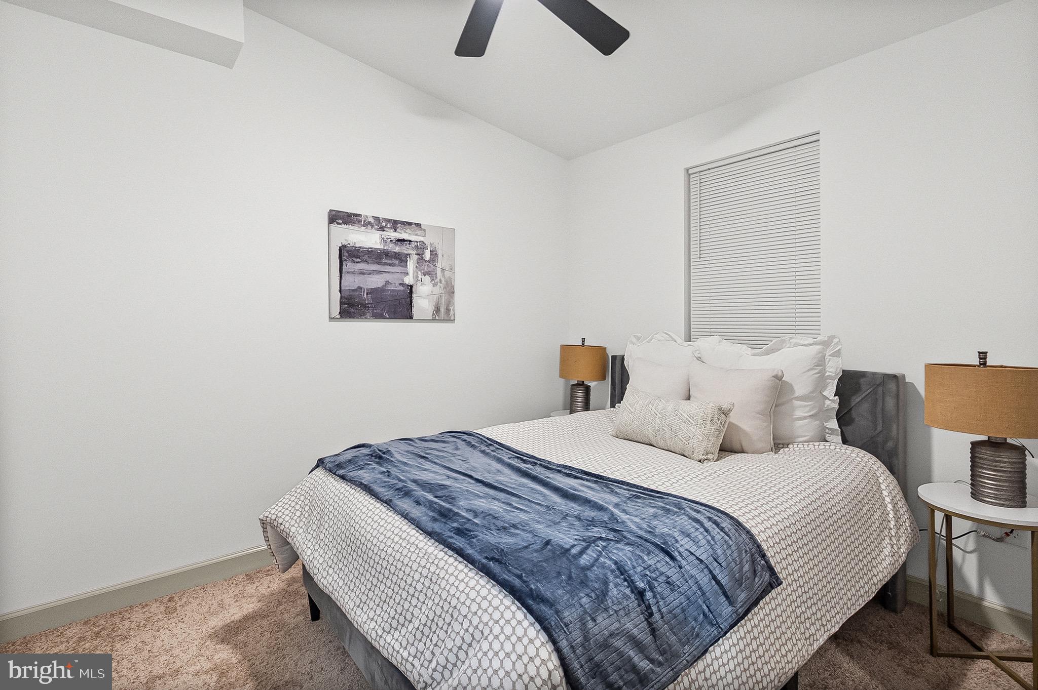 2508 East Preston Street Baltimore, MD 21213 - Photo 24 of 29 a bedroom with a bed and a painting on the wall