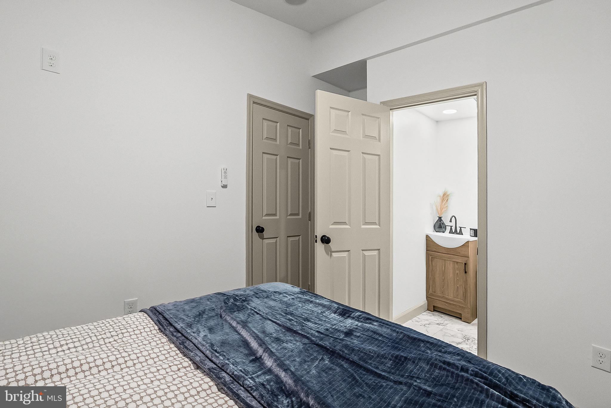 2508 East Preston Street Baltimore, MD 21213 - Photo 25 of 29 a bedroom with a bed and a sink