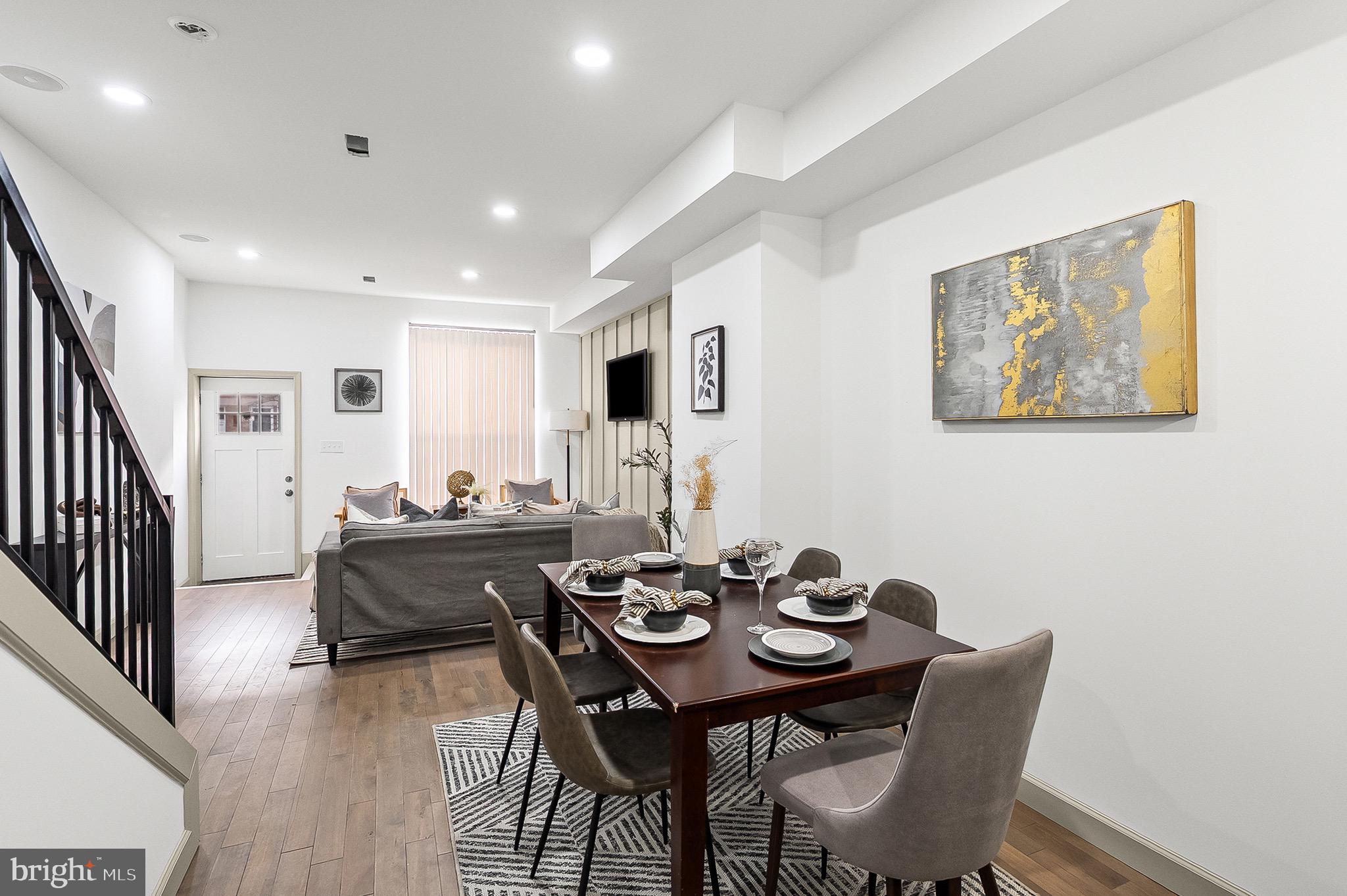 2508 East Preston Street Baltimore, MD 21213 - Photo 4 of 29 a view of a dining room with furniture and wooden floor