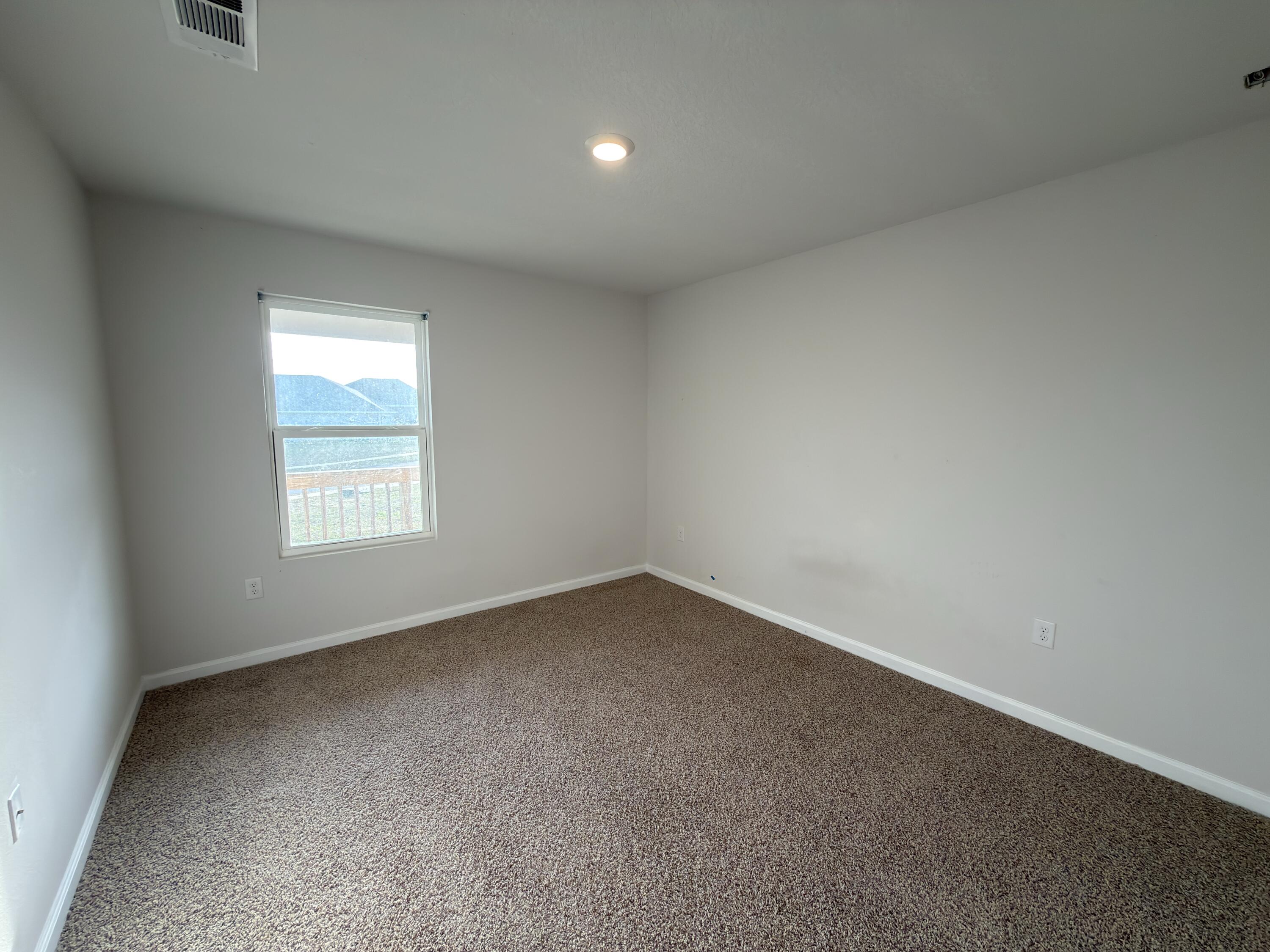 3545 Sugar Maple Lane Crestview, FL 32539 - Photo 22 of 27 an empty room with a window